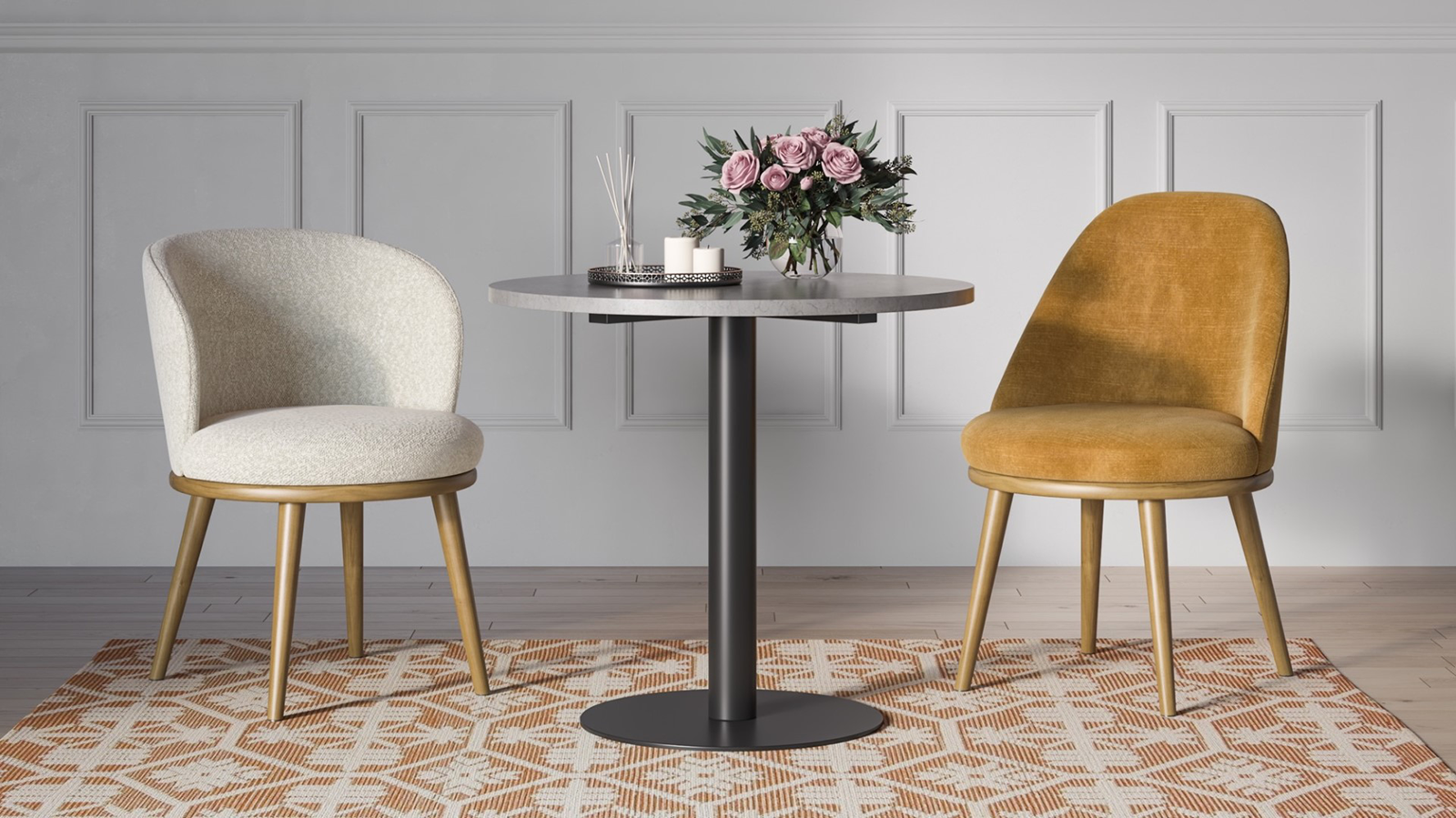 two chairs around a round table with flowers